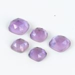 Medium tone amethyst and mother of pearl doublets