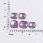 Medium tone amethyst and mother of pearl doublets