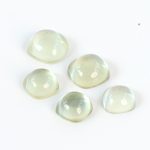 Green amethyst and mother of pearl doublets