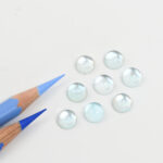 Blue topaz and mother of pearl round cabochon 8mm