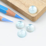 Blue topaz and mother of pearl round cabochon 10mm