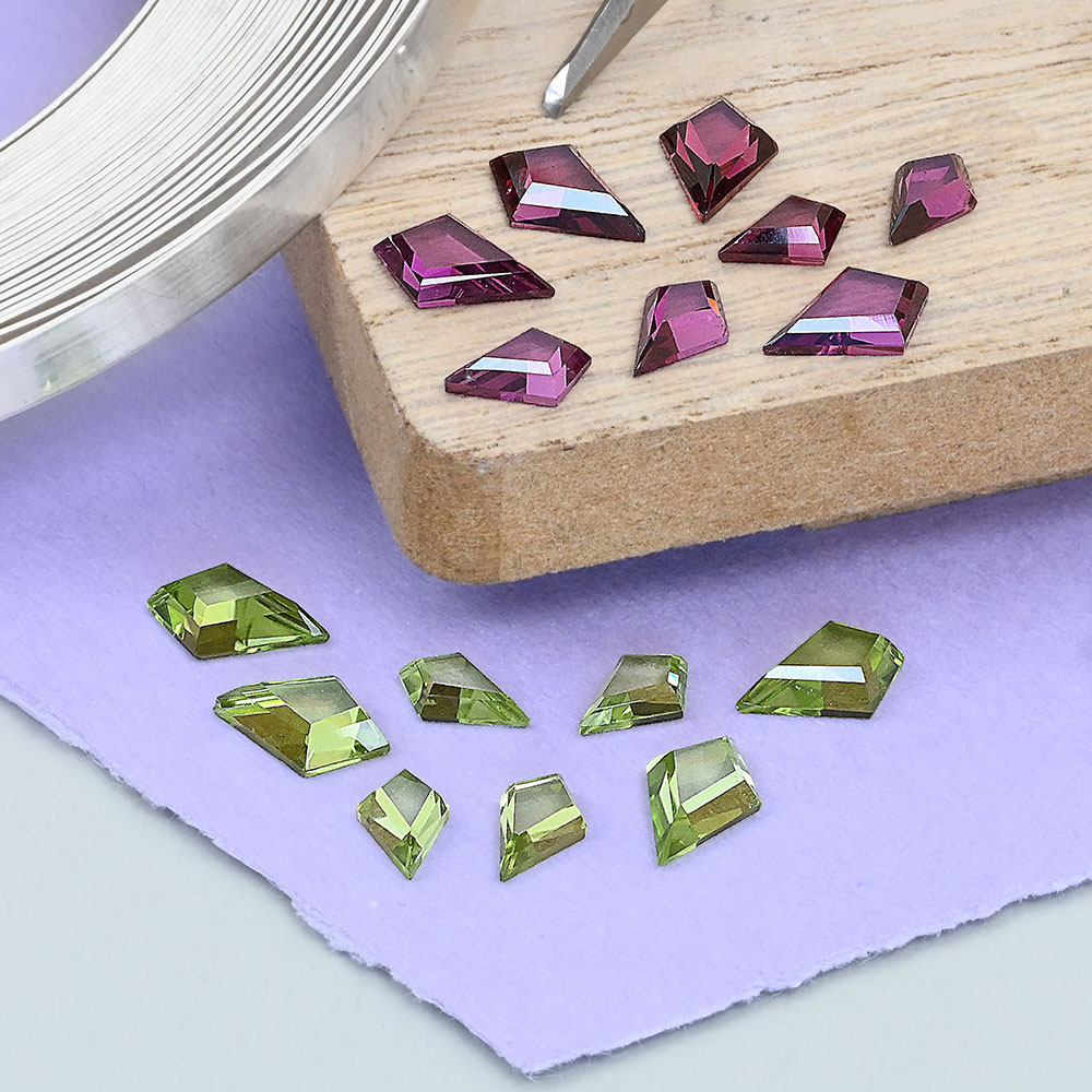 Peridot and rhodolite garnet kite cut gemstones